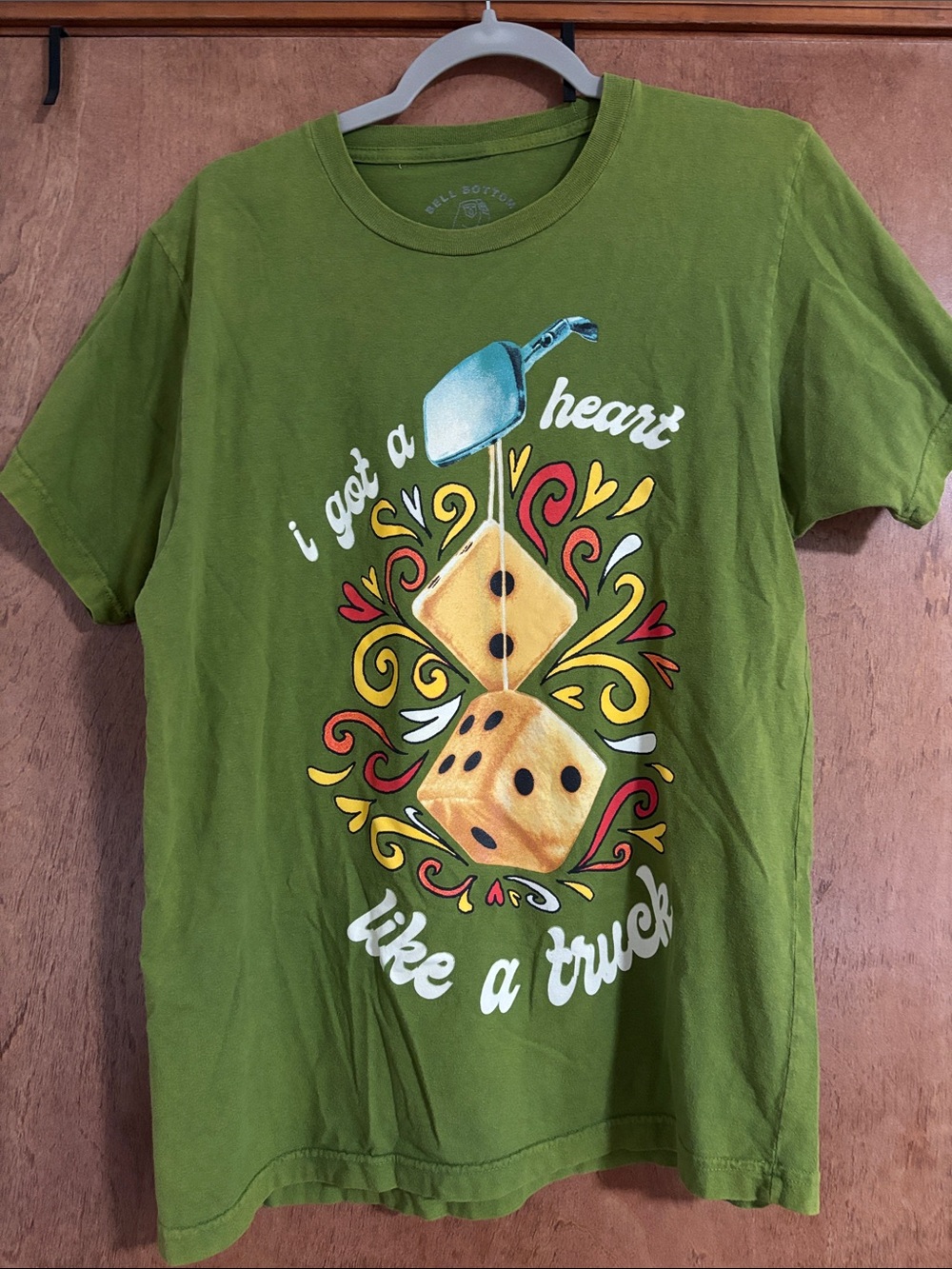 Laney Wilson Women’s Green Graphic Tee with Dice Heart Design
